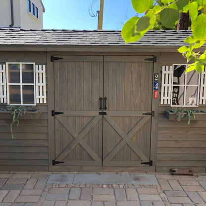 stained cedar wood longhouse shed with window boxes and shutters