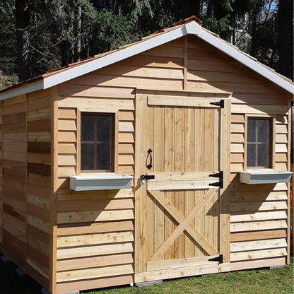 cedar cabin with dutch door and window boxes